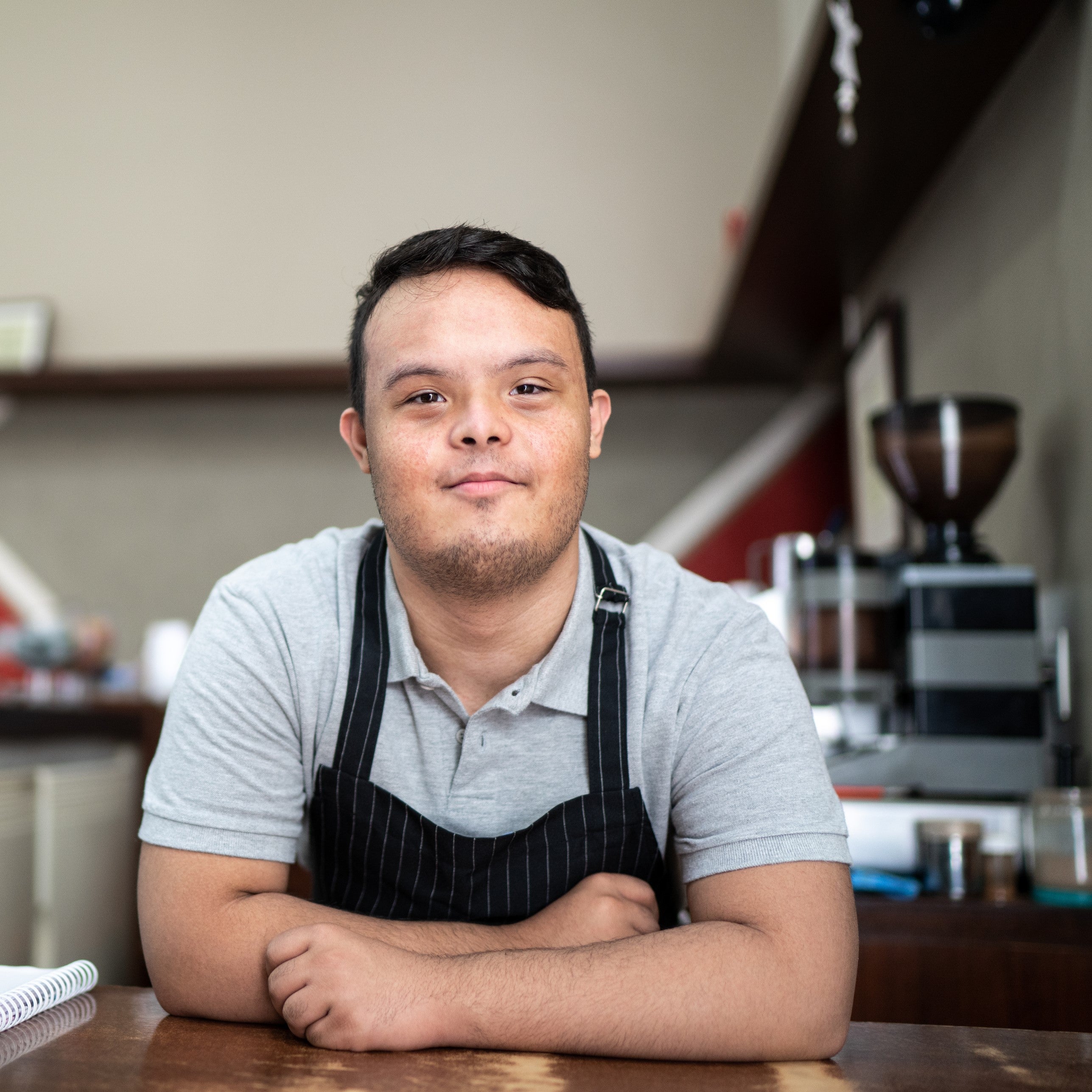 Man with Down syndrome working at a coffee shop